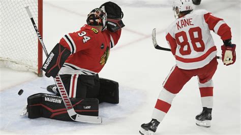 Patrick Kane scores in overtime in Chicago return, sending Red Wings past the Blackhawks 3-2 ...