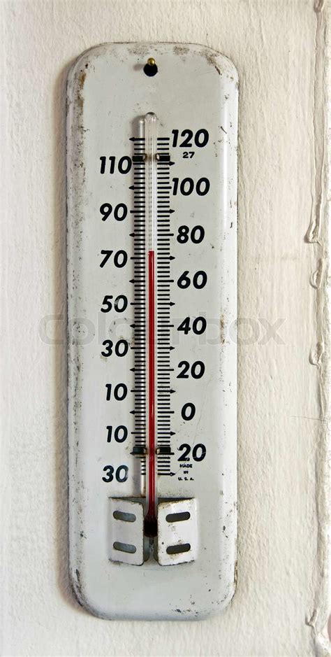 vintage white enamel outdoor thermometer on the wall | Stock image | Colourbox