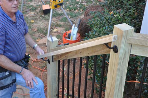 Step by step instructions for how to install deck stair railings. Learn about the code ...