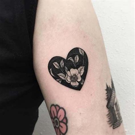 Negative space heart shaped flower tattoo - Tattoogrid.net