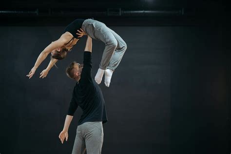 Strong Man Lifting the Woman with One Hand · Free Stock Photo