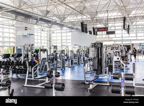 Bodybuilding equipment inside gym Stock Photo - Alamy