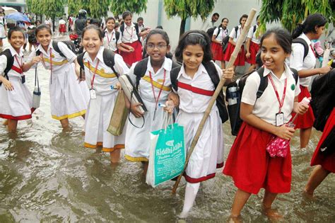 View Patna2: Notre Dame Academy girls wade through the rain waters