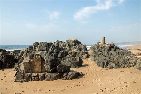 Rocks on Sandy Beach and Blue Coastal Skyline Stock Photo - Image of beach, nature: 86083356