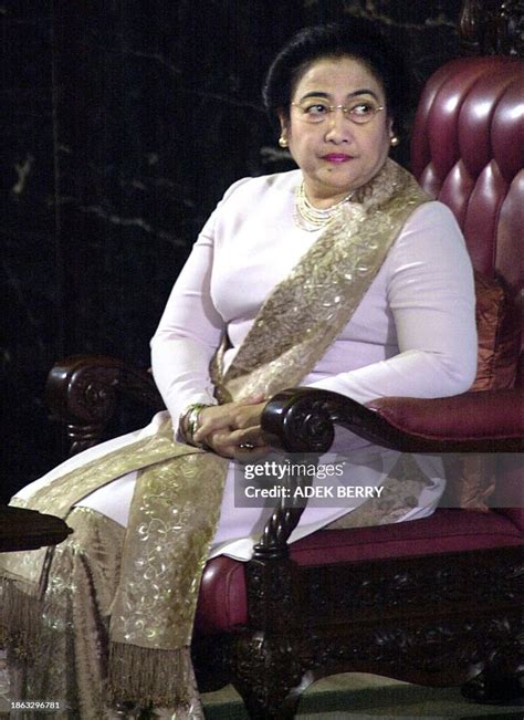 TOPSHOT - Indonesian President Megawati Sukarnoputri listens to Amien ...