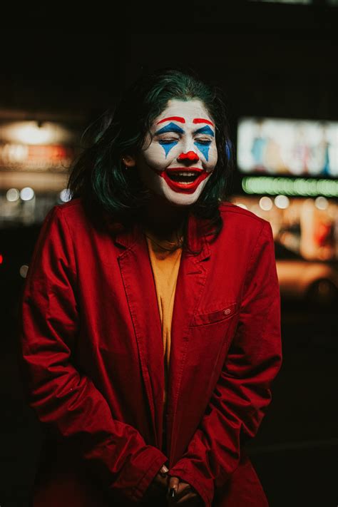 Shallow Focus Photo of Person in Red Coat With Clown Face Paint · Free Stock Photo
