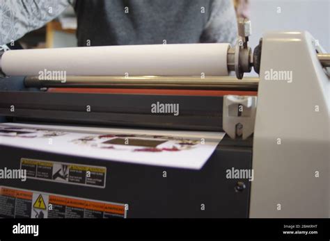 Plastic laminating machine Stock Photo - Alamy