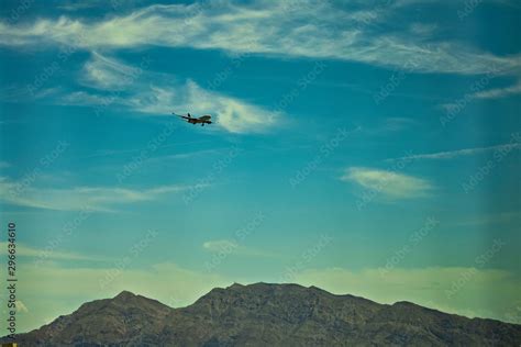 Flying plane above mountains Stock Photo | Adobe Stock