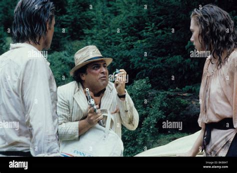 ROMANCING THE STONE (1984) MICHAEL DOUGLAS, DANNY DEVITO, KATHLEEN TURNER RMST 007 Stock Photo ...