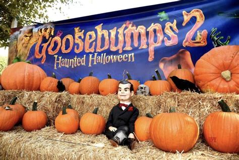 there is a fake pumpkin sitting in front of some hay bales with jack ...