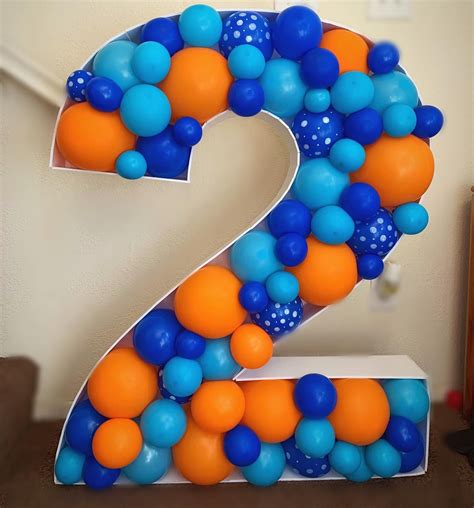 A custom number 2 with hand painted balloons for a special little boy!! Balloon garland to match ...