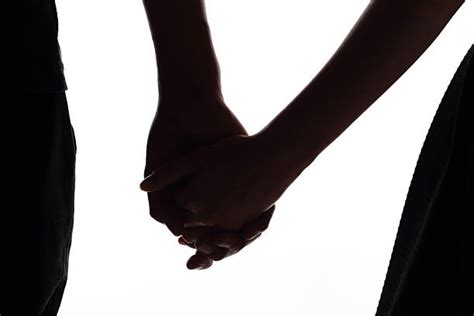 Shadow Of Couple Holding Hands Stock Photos, Pictures & Royalty-Free Images - iStock