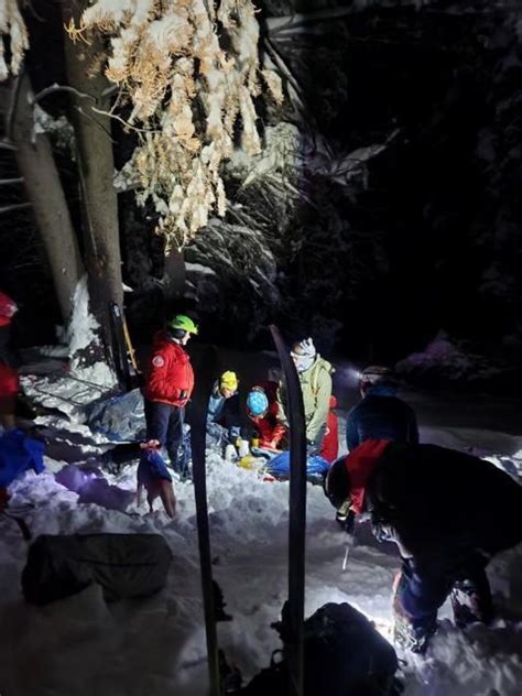 Skier rescued after being buried "chest-deep in debris" by avalanche in ...