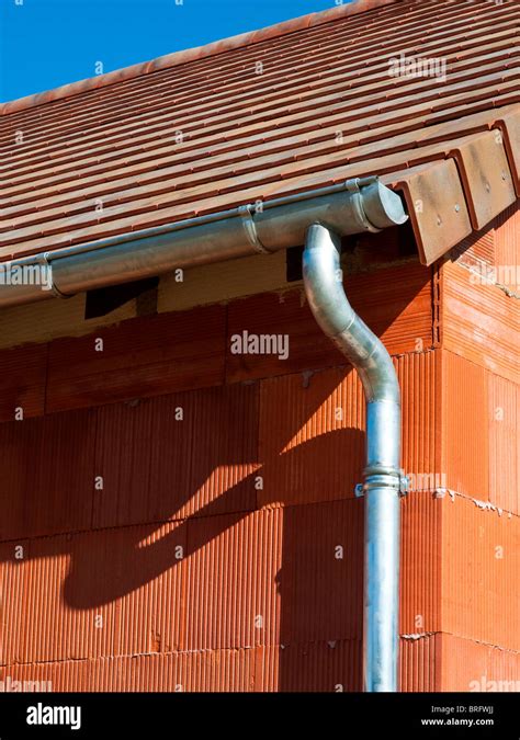 New bungalow construction showing galvanized rainwater gutter and Stock ...