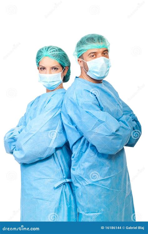 Two Surgeons In Sterile Uniforms Stock Photo - Image of portrait, mask ...