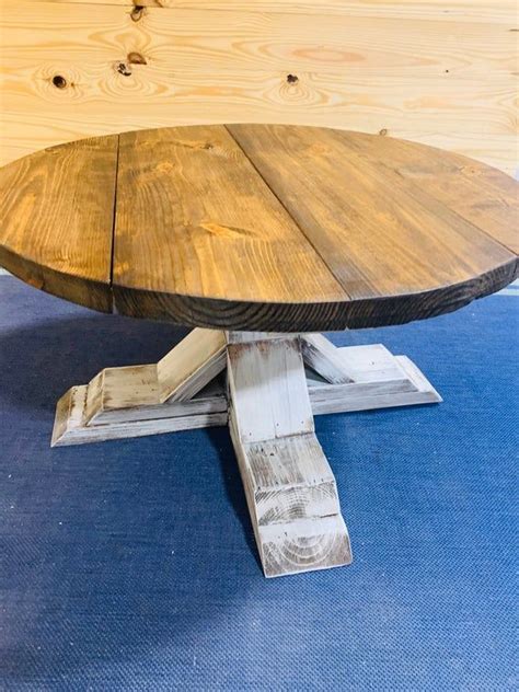 Bring this rustic farmhouse round coffee table into your living room today. This handmade wooden ...