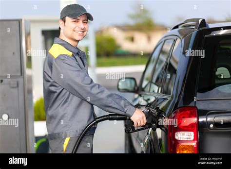 Gas station attendant at work Stock Photo - Alamy