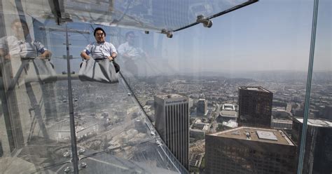 Ride the U.S. Bank Tower's glass Skyslide with 70 floors of nothingness below you - Los Angeles ...