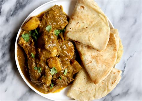 The Best Trinidadian Curry Chicken (Plus Bonus Green Seasoning Recipe) - Travelandmunchies