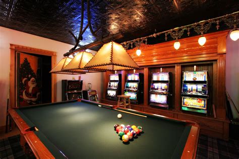 pool table and slot machines in a basement game room | Game room basement, Game room, Basement games