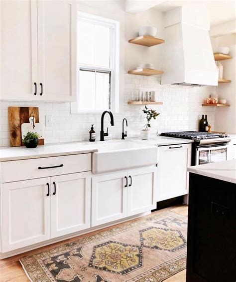 white cabinets with black hardware | Home decor, White kitchen design, Neutral kitchen designs