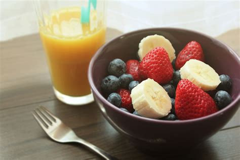 Mango Juice In Glass and Fruit Salad In Bowl