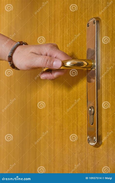 Person holding door handle stock photo. Image of opening - 10937514