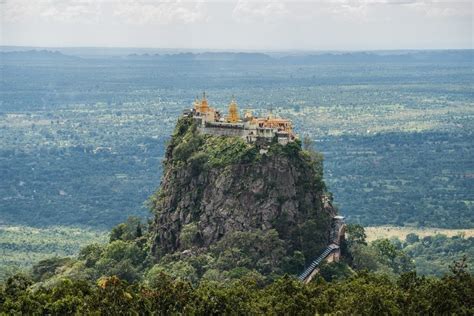 Mount Popa is a solitary peak topped by gold stupas peak - spectacular views