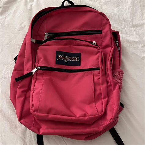 Hot pink jansport backpack with lots of pockets and... - Depop