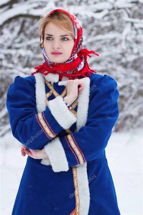 Russian beauty woman in traditional clothes Stock Photo by ©Demian 64471457