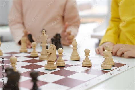 Diverse Group of kids playing chess. Concentrated multiethnic clever ...