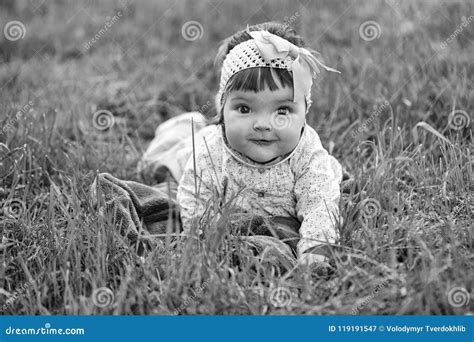 Child Lies on the Grass and Smiles. Cute Baby Girl on Green Grass Stock Image - Image of sitting ...