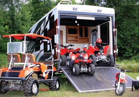 Keystone Raptor fifth wheel toy hauler exterior showing toys and toy hauling area