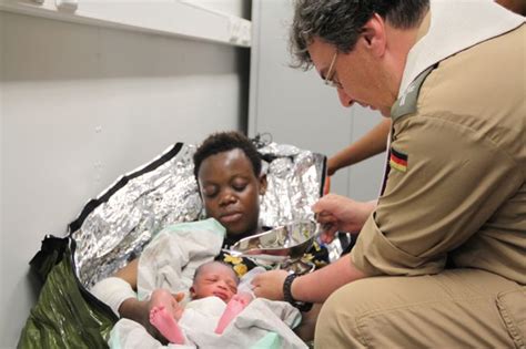 Baptism at sea – refugee child born during boat rescue - Ave Maria Radio