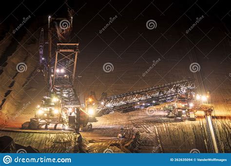 Heavy Mining Equipment at Work in an Open-pit Mine at Dusk Stock Photo ...