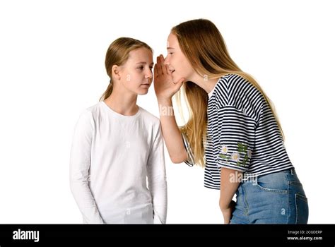 Girls whispering secrets Cut Out Stock Images & Pictures - Alamy