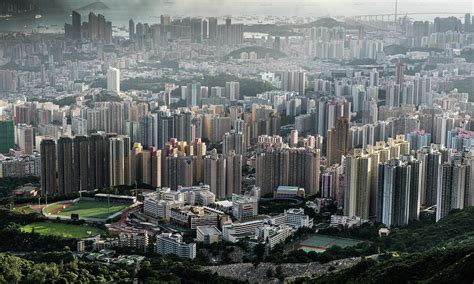 Skyline Of Kowloon Photograph by Steve Schechter - Spikesphotos.com