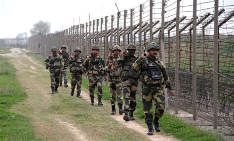 Soldiers patrol along the Indo-Pak border