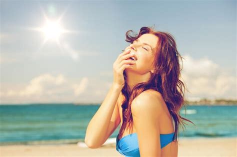 Premium Photo | Bright picture of laughing woman on the beach.