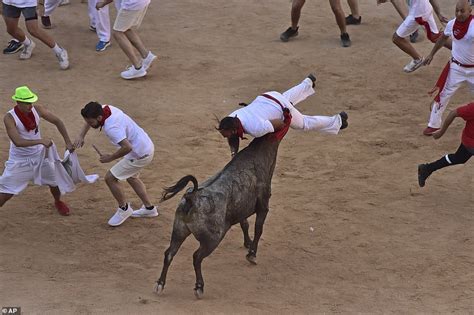 Bull runners are thrown into the air while several others are trampled by animals | Daily Mail ...