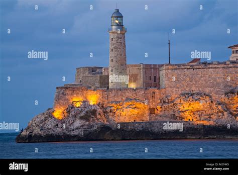 Castillo Del Morro and Lighthouse from the El Malecon at dusk, Havana, Cuba, West Indies ...