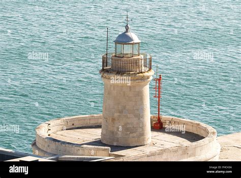 lighthouse in the port Stock Photo - Alamy