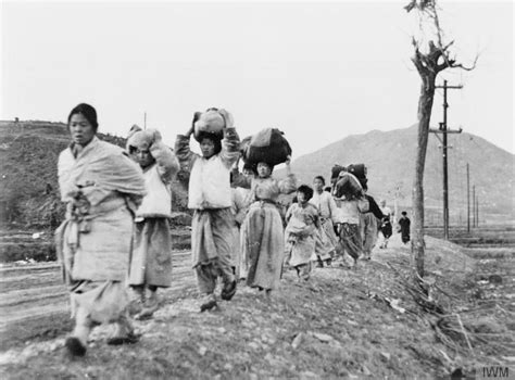 Korean refugees leaving the battle area - women and children carrying ...