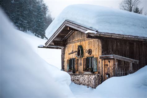 old traditional wooden cabin lodge shack in bavarian alps with lots of snow in winter - Mr. Breath