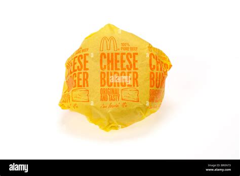 McDonald's cheeseburger in paper wrapper packaging on white background ...