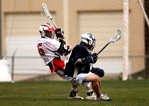 Person in Black Sports Jersey Playing Lacrosse · Free Stock Photo