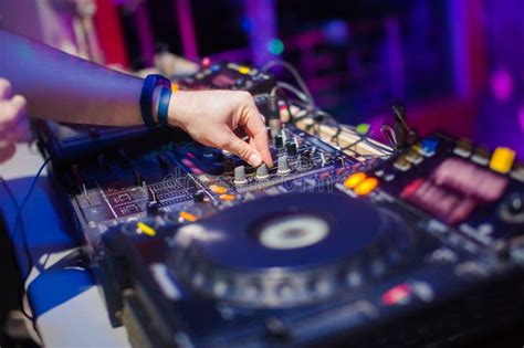 DJ Mixing Music On Console At The Night Club Stock Image - Image of blue, audio: 62781455