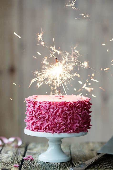 Pink Celebration Cake With Sparkler | Stocksy United | Birthday cake sparklers, Cake sparklers ...