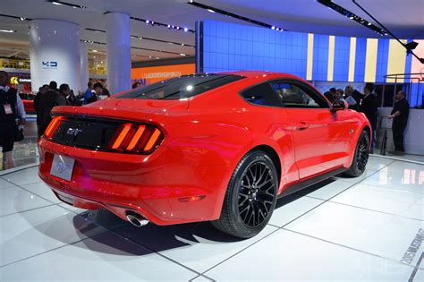 2015 Ford Mustang GT red rear three quarters at NAIAS 2014