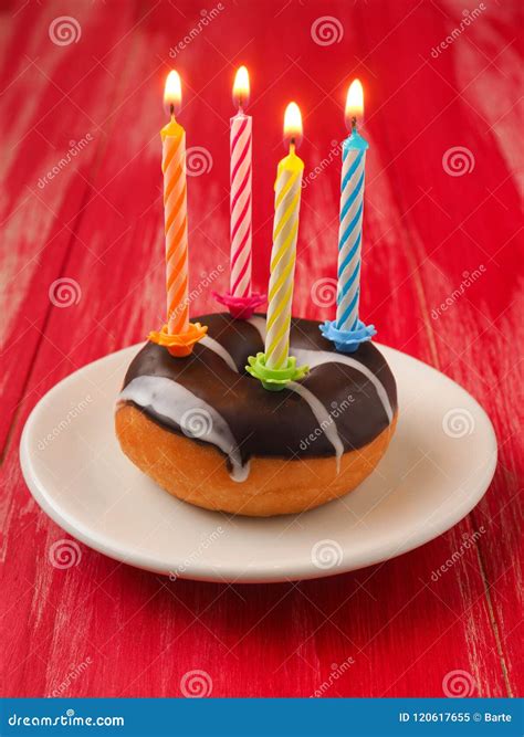 Birthday Candles on a Donut Stock Image - Image of celebration, illuminated: 120617655